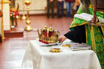 newlyweds exchange wedding rings on a ceremony in the church