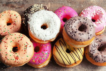 Glazed donuts on wooden background
