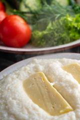Mengrelian corn mamalica (ghomi) with cheese. Georgian food.