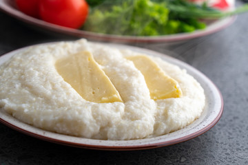 Mengrelian corn mamalica (ghomi) with cheese. Georgian food.