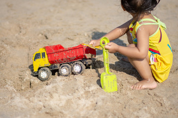 Children playing on sand beach with sunny day. soft focus.