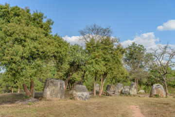 The Plain of Jars site 3 sits on a scenic hillside in pretty woodland near the village of Ban Lat Khai, Phonsavan, Xieng Khouang Province.