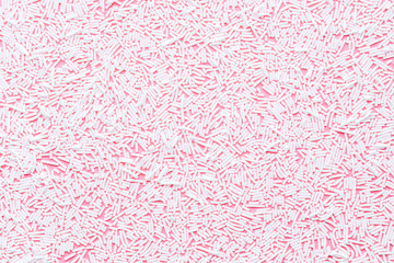trendy pattern of white sprinkles over pink background, decoration for donut glaze background