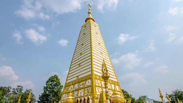 Time lapse of 4-sided shape pagoda : architecture landscape of white and gold pagoda at wat Phrathat Nong Bua in Ubon Ratchathani province, Thailand