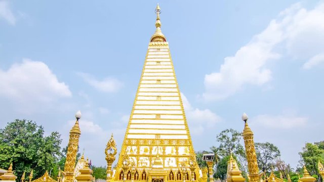 Time lapse of 4-sided shape pagoda : architecture landscape of white and gold pagoda at wat Phrathat Nong Bua in Ubon Ratchathani province, Thailand