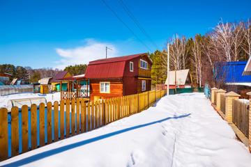 Naklejka premium Country house in winter. Western Siberia