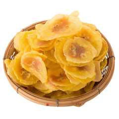 Dried banana chips in wooden bowl. Yellow deep fried slices of bananas Isolated on white background