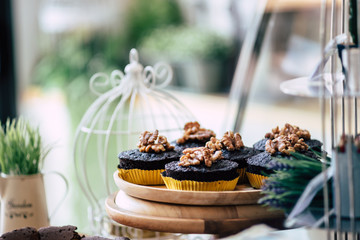Chocolate cupcake on top cashews in bakery cafe