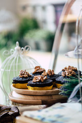 Chocolate cupcake on top cashews in bakery cafe