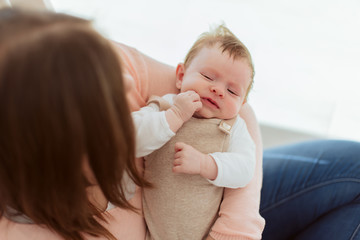 Young Mother holding newborn baby