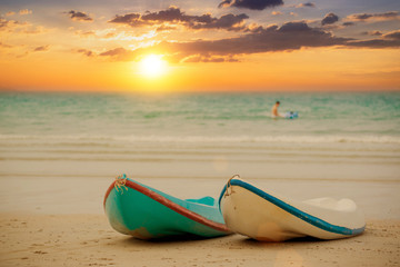 kayaks on the tropical beach in beautiful sunset ,island in thailand, Canoe on the ocean beach during the amazing evening.