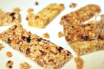 Bar of healthy cereal sweet snacks on white background. Top table dish, close up