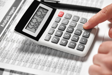 Businessman working and calculating finance. Business financial accounting concept. Closeup hands.