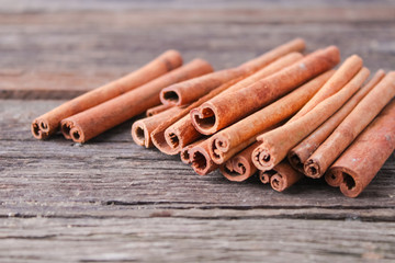 cinnamon sticks on wooden background