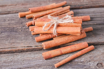 cinnamon sticks on wooden background