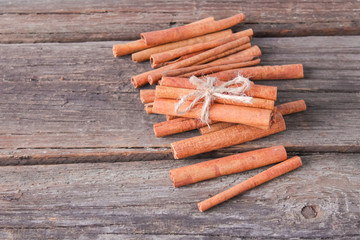 cinnamon sticks on wooden background