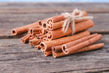 cinnamon sticks on wooden background