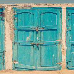 Turquoise door in port Essaouira, Morocco