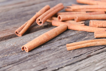 cinnamon sticks on wooden background