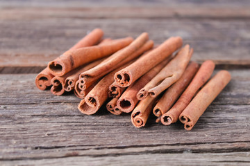 cinnamon sticks on wooden background
