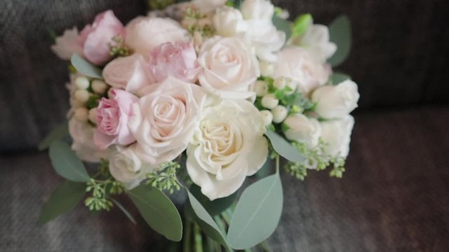Panorama of a beautiful wedding bouquet of white and pink roses on the couch in the apartment or Studio