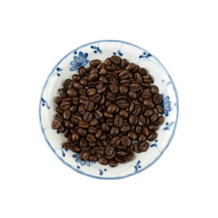 coffee beans in a white dish