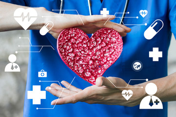 Doctor pushing button heart pulse healthcare in network internet on virtual panel medicine.
