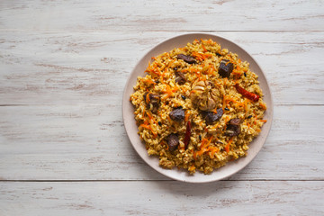 Plate of meat pilaf. Asian dish. Top view.