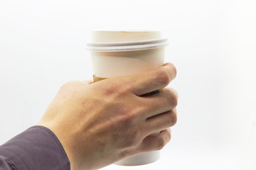Hand is hloding plastic cup on isolated white background