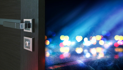 Empty scene background. Open wooden doors. Behind the open door background with night blurred lights, bokeh, neon lights