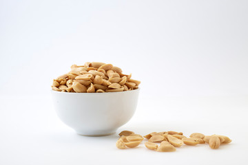 Roasted peanuts and salt in a bowl