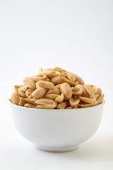 Roasted peanuts and salt in a bowl