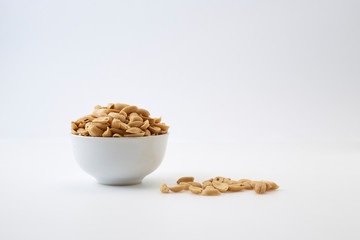 Roasted peanuts and salt in a bowl