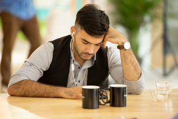 bored man employee sitting at desk has no motivation to work