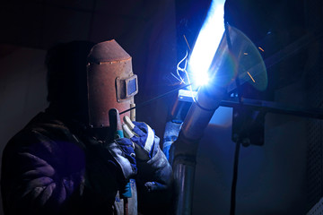 Workers welding operation