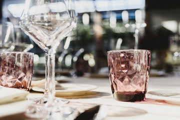 Original empty cutlery with elegant water glasses.