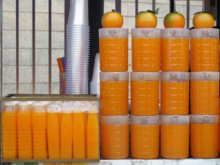 Fresh orange juice in the bottle for sale at the market