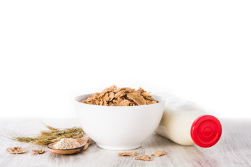 Oats milk and cereals on white wooden table and white background. Copyspace