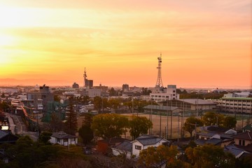 Fototapeta na wymiar Blazing Sunset Over Downtown Saga in Saga Prefecture