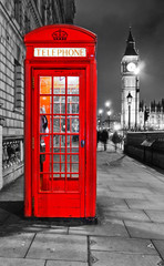 Fototapeta na wymiar View of the Telephone Box and Houses of Parliament in London at night.
