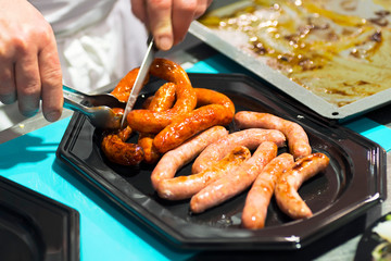 chef  preparing sausages to eat