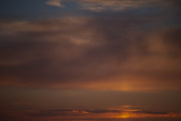 Fototapeta na wymiar clouds in the sunset sky in mid-March