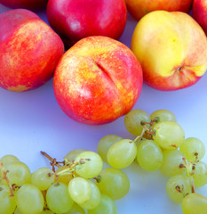 fresh fruit excellent for your health, ready and cut: nectarine, grapes