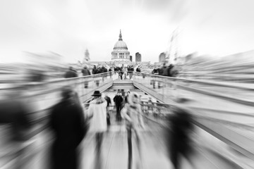 View from Millennium Bridge with lots of passengers passing through in London.