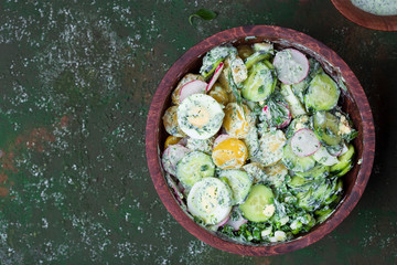potato salad with egg, radishes and cucumbers