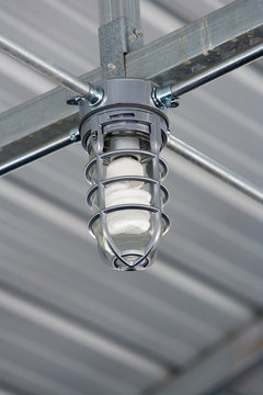 Light bulb in metal building.