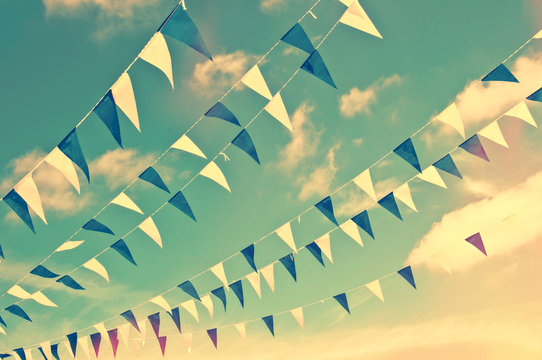 Festive blue and white garlands, vintage summer party sky background