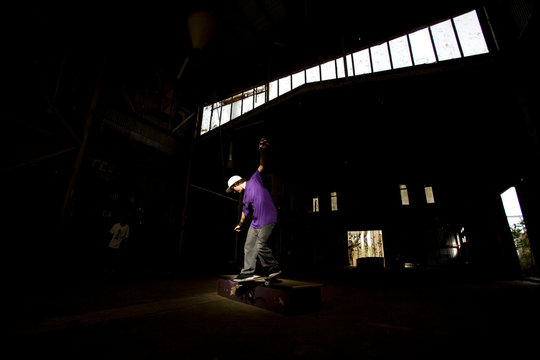 Australian skater Mitch Faber performs a smith grind at an abandoned warehouse on the Central Coast, New South Wales, Australia.