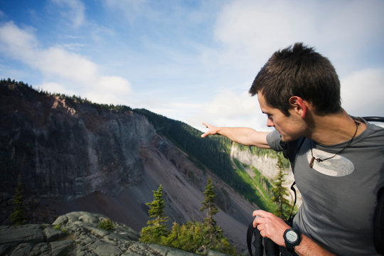 Geology graduate student Peter Schoen explains the landslide hazard potential from The Barrier, an unstable volcanic cliff near Squamish, British Columbia. The Barrier is an enormous lava dam retaining Garibaldi Lake in southwestern British Columbia. It formed when lava flows from Mount Price (Clinker Peak) flowed towards the Cheakamus River Valley but were impounded by glacial ice, forming a steep cliff when the glaciers receded.