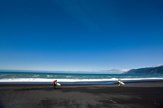 Jeff Daniel and Dan Duane hike with their surfboards while on a surfing and backpacking trip to The Big Flat located eight miles north of Shelter Cove on The Lost Coast, California.